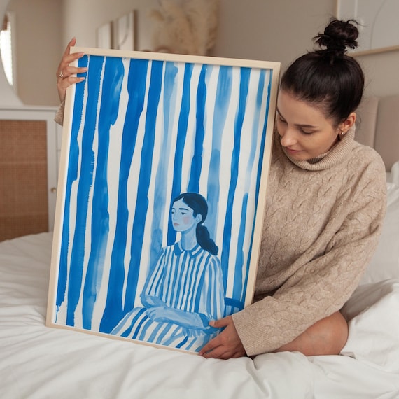 Woman in a Striped Dress Amid Bold Blue Vertical Brushstrokes Poster