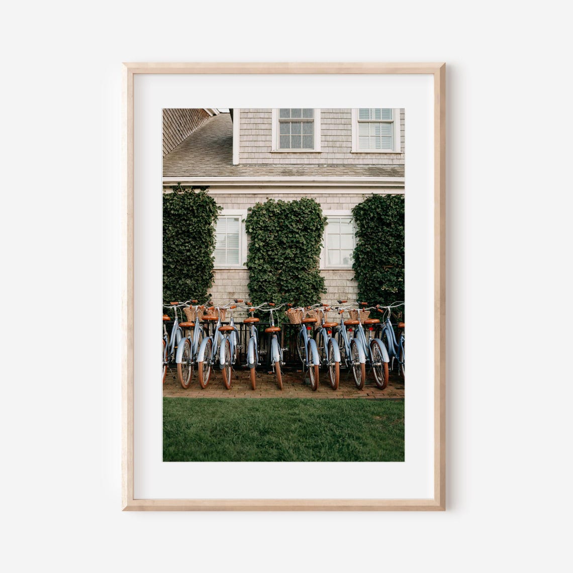 Blue Beach Cruiser Bicycles Lined Up by an Ivy-Covered Cottage Poster