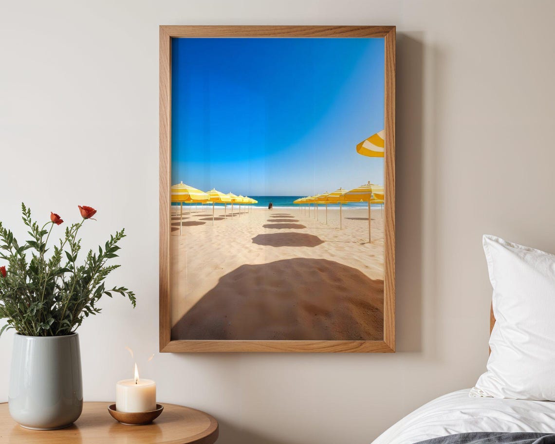 Yellow Beach Umbrellas Row on Sand Under Bright Blue Sky Poster