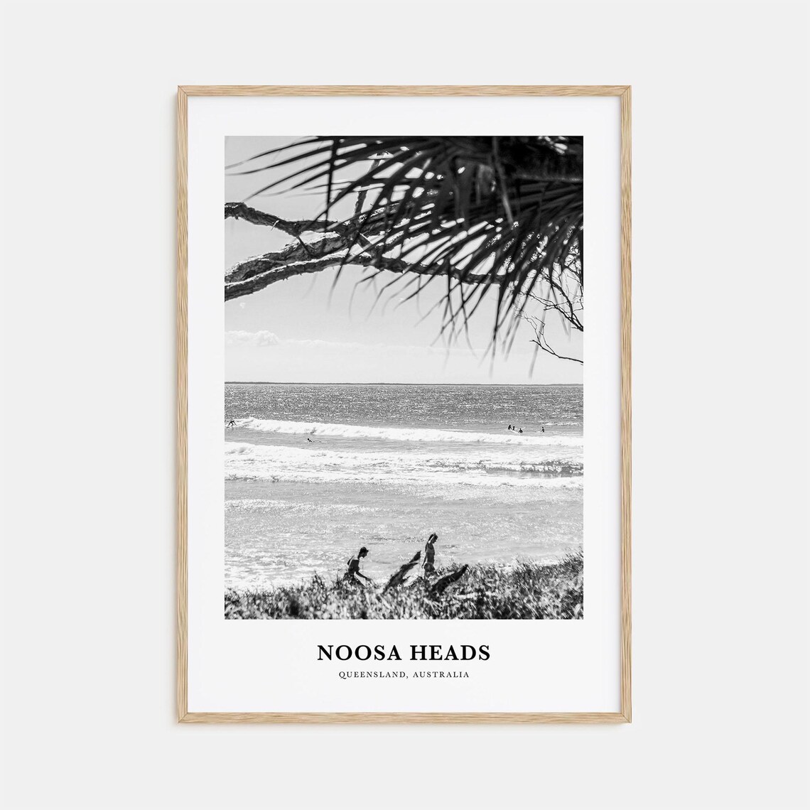 Noosa Heads Surf Beach Through Palm Fronds with Surfers Poster