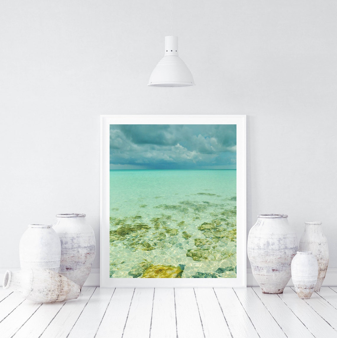 Crystal Clear Shallow Sea with Rocks Under Storm Clouds Poster - Image 3