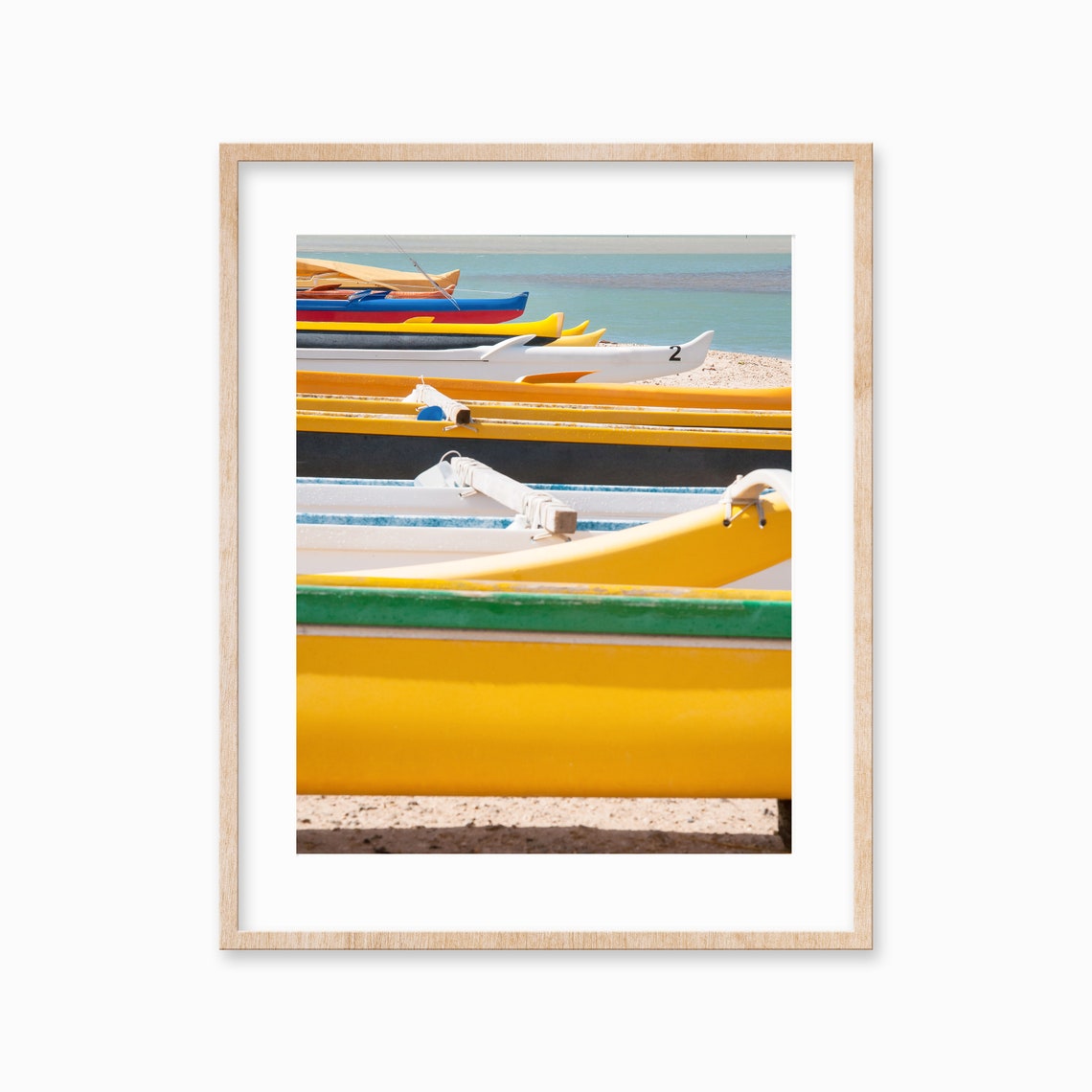 Colorful Outrigger Canoes Lined Up on Sandy Beach Shore Poster