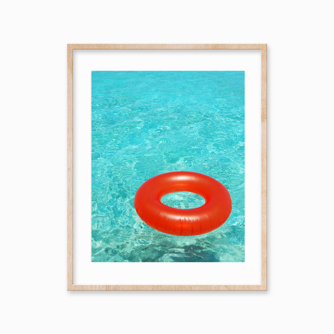 Bright Orange Pool Float Ring Floating in Turquoise Water Poster