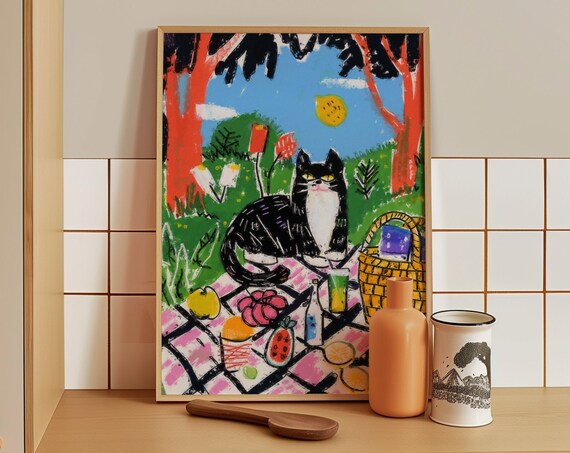 Black and White Cat Enjoying a Sunny Picnic in the Park Poster