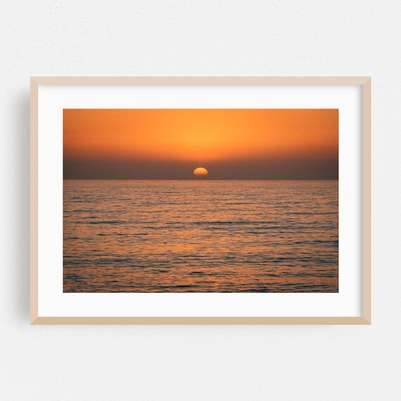Minimalist Ocean Sunset Poster with Calm Waves and Warm Horizon Glow