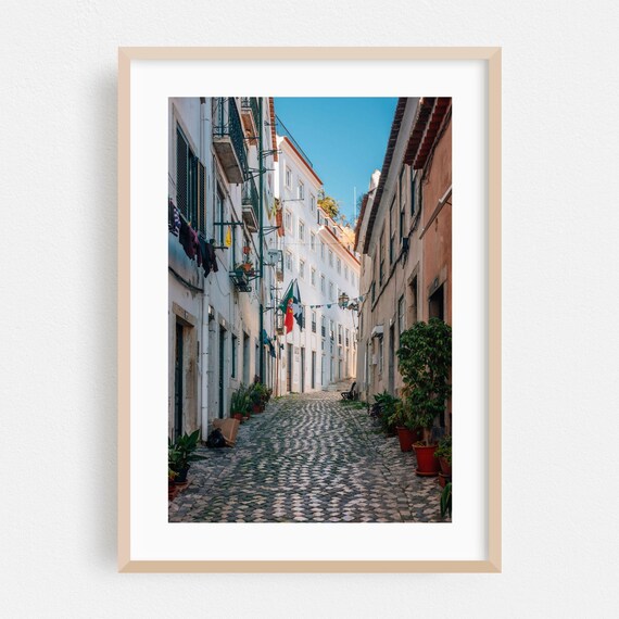 Lisbon Portugal Cobblestone Street with Balconies and Flags Poster