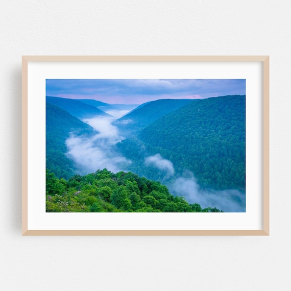 Morning Fog Drifting Through A Green Mountain Valley Dawn Poster