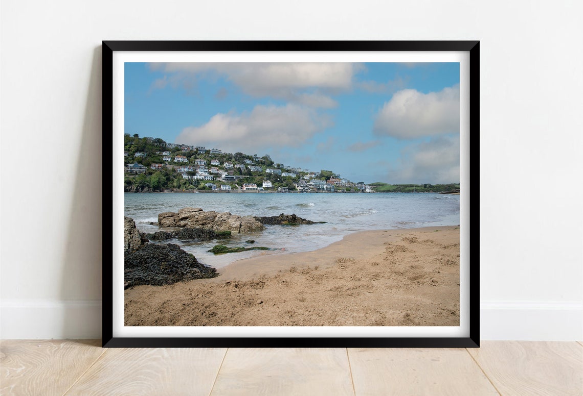 Seaside Town Across the Bay With Rocky Shores and a Sandy Beach Poster
