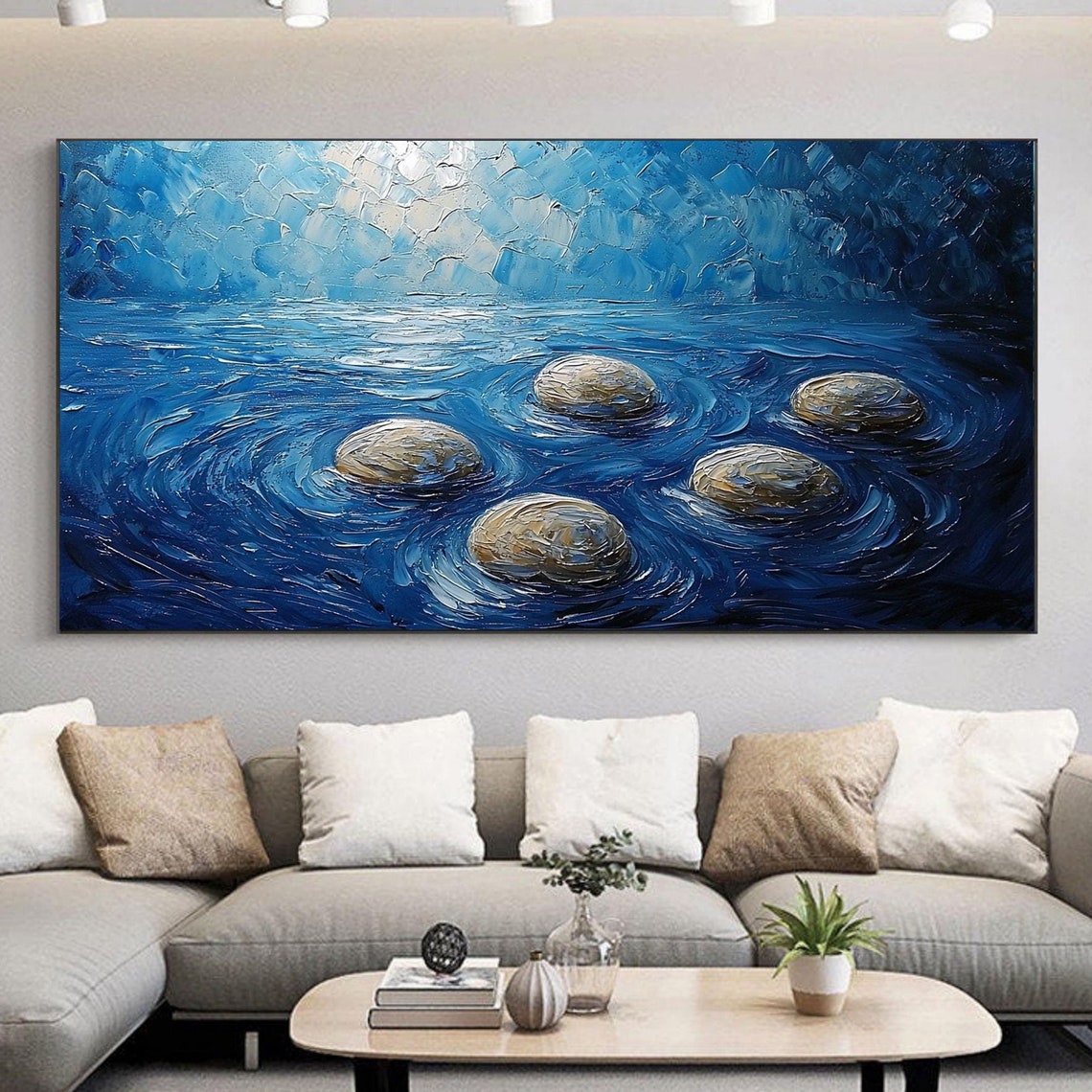 Smooth River Stones Resting In Swirling Deep Blue Water Poster