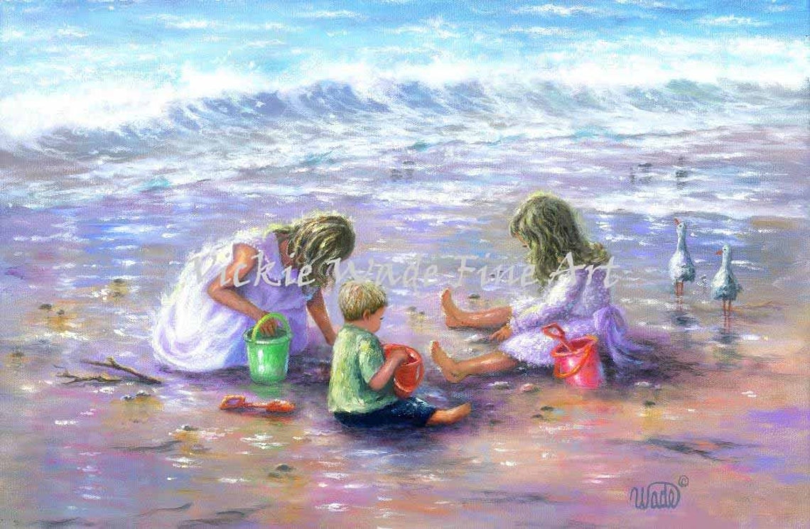 Three Children Playing Happily with Buckets on the Beach Poster