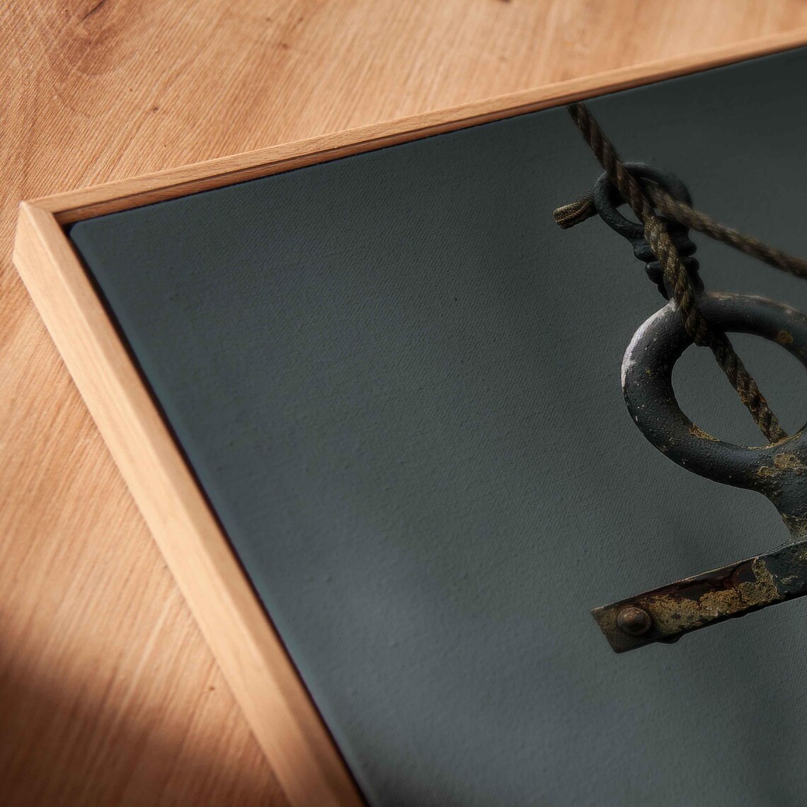 Weathered Iron Anchor Hanging With Rope On Dark Moody Background Poster - Image 2