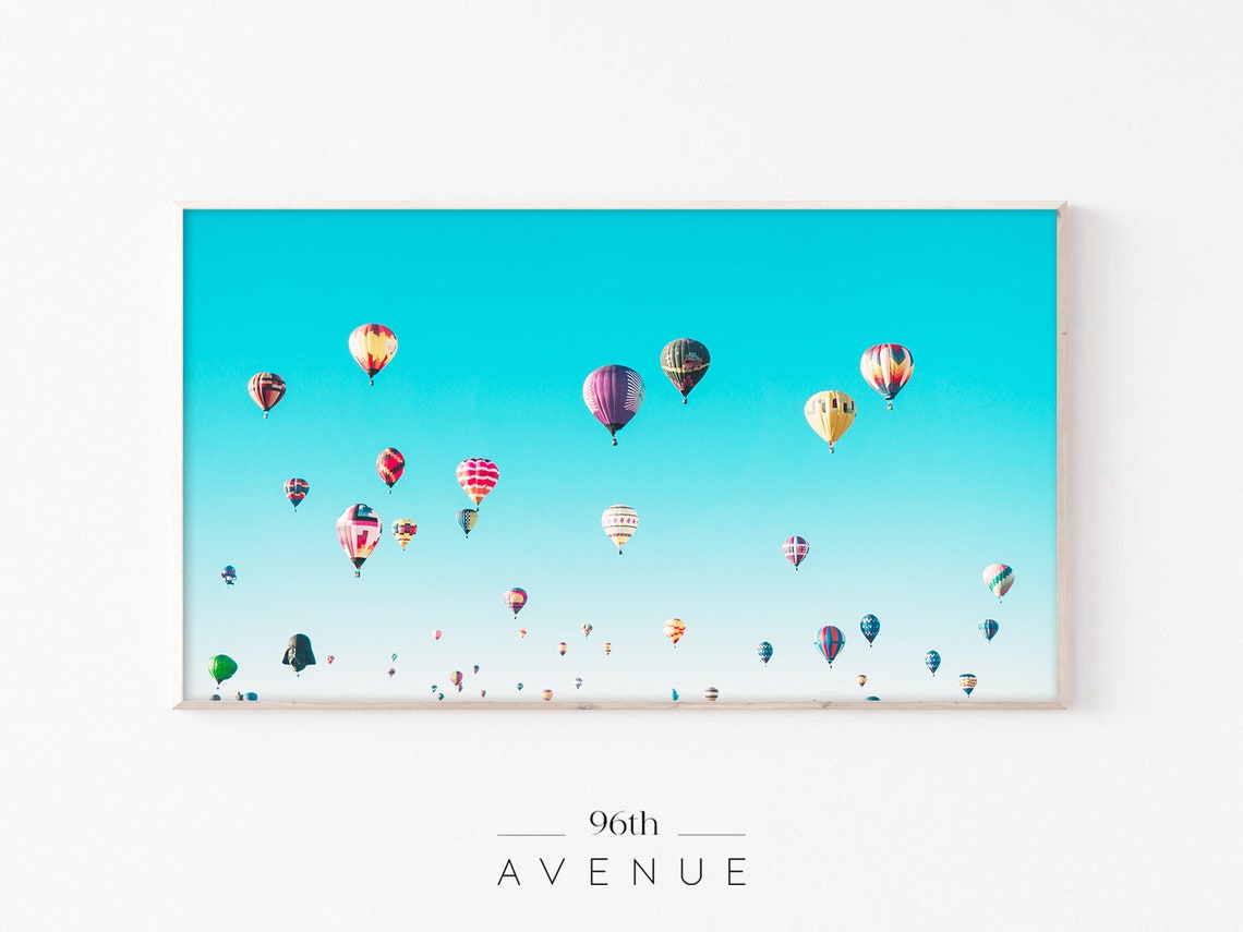 Colorful Hot Air Balloons Floating in a Turquoise Sky Poster