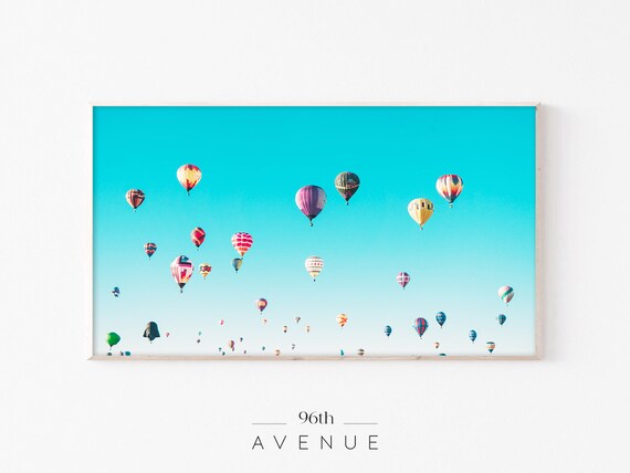 Colorful Hot Air Balloons Floating in a Turquoise Sky Poster