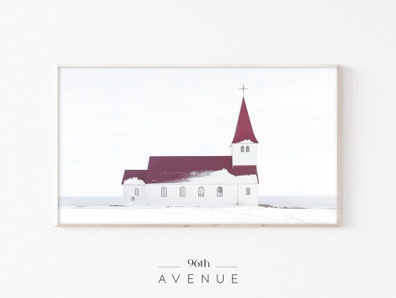 White Country Church With Red Roof in Snowy Winter Landscape Poster