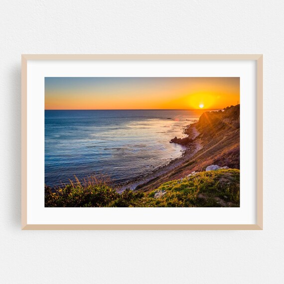 Golden Los Angeles Sunset Over Ocean From Rocky Cliffside Poster