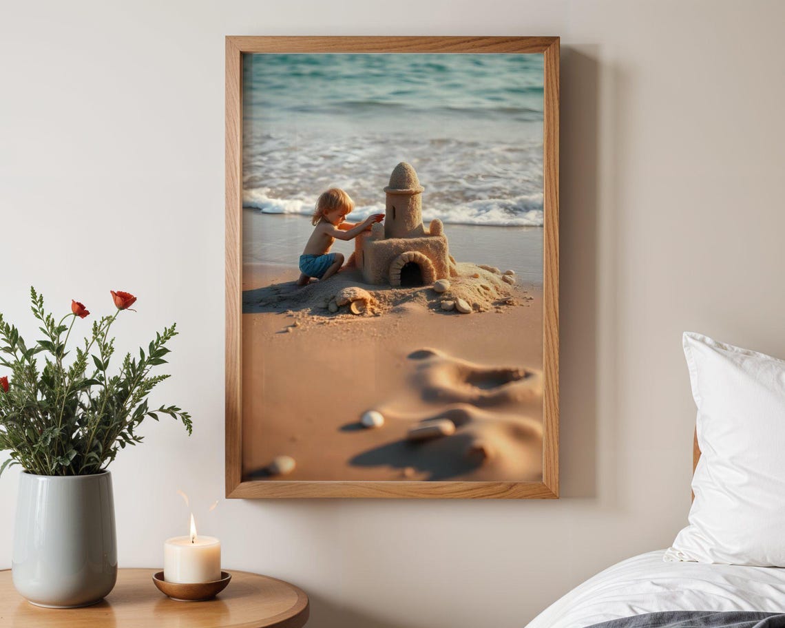 Happy Child Building A Sandcastle On The Shore At Golden Hour Poster