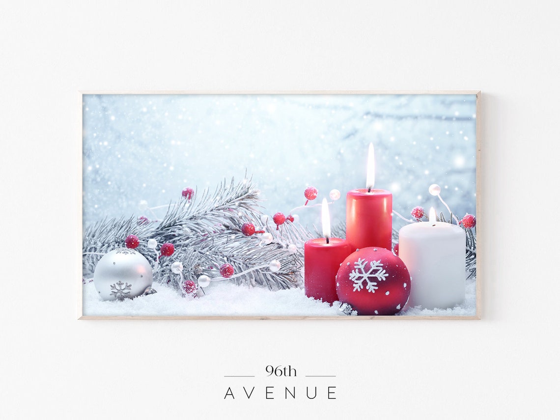Glowing Christmas Candles With Ornaments on Snowy Pine Poster