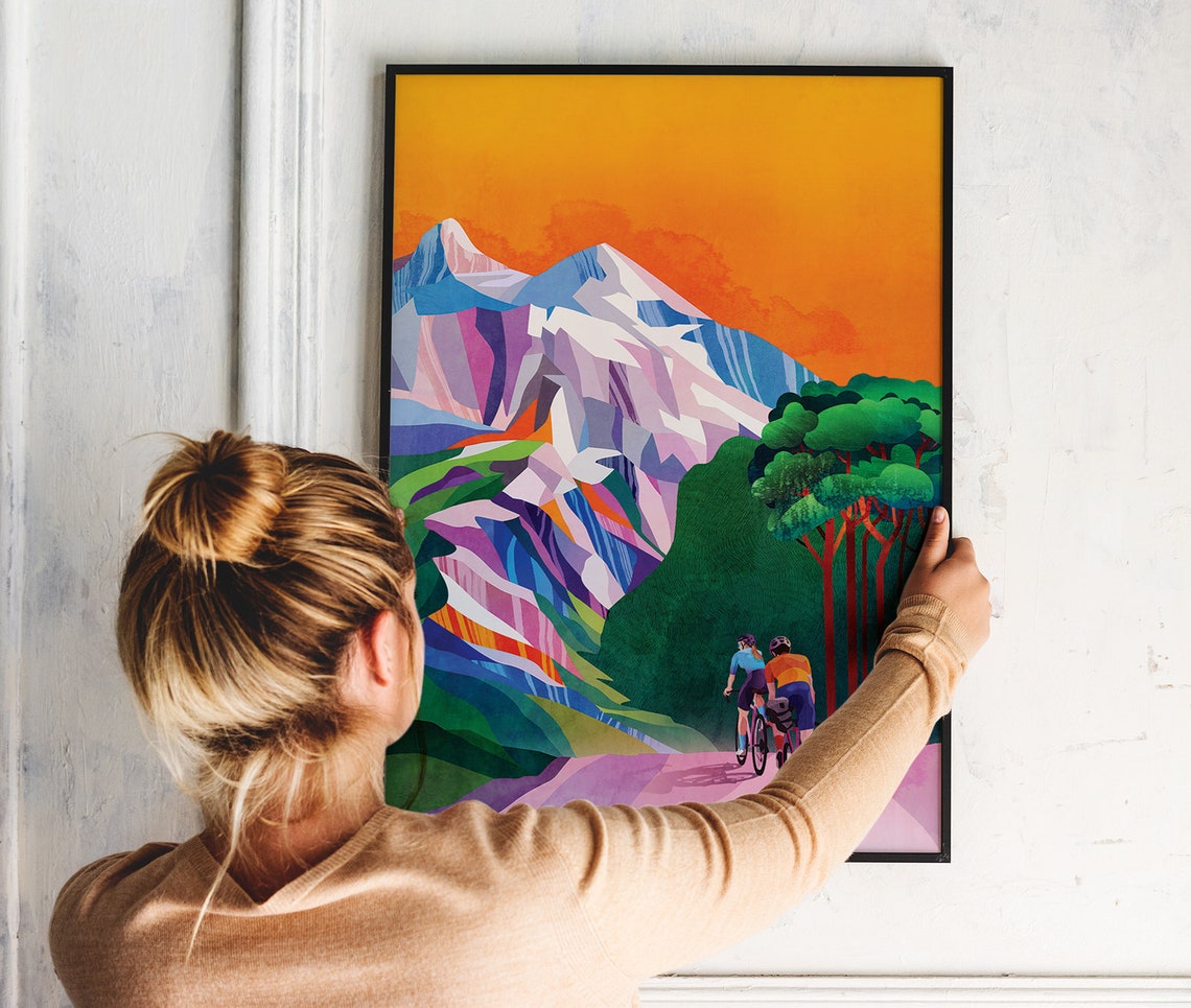 Cyclists Riding Toward Snowy Peaks at Sunset Orange Sky Poster - Image 4