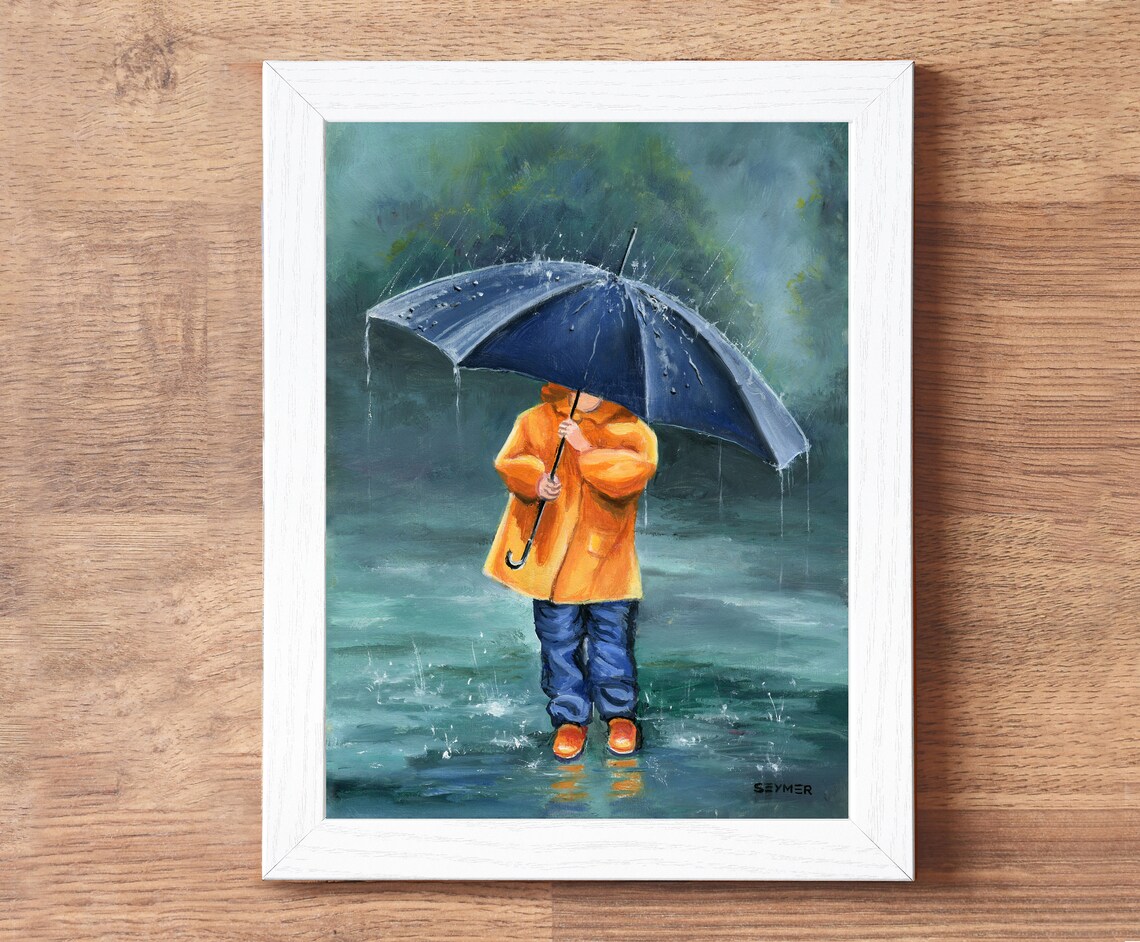 Child in an Orange Raincoat Holding a Navy Umbrella in the Rain Poster - Image 4