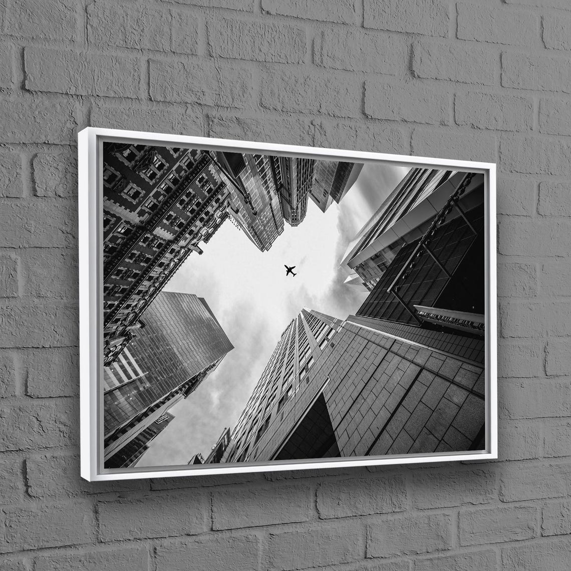 Black and White City Skyscrapers Airplane Sky Upward View Poster