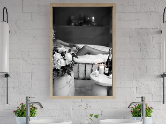 Woman Relaxing in Bubble Bath with Flowers and Champagne Poster