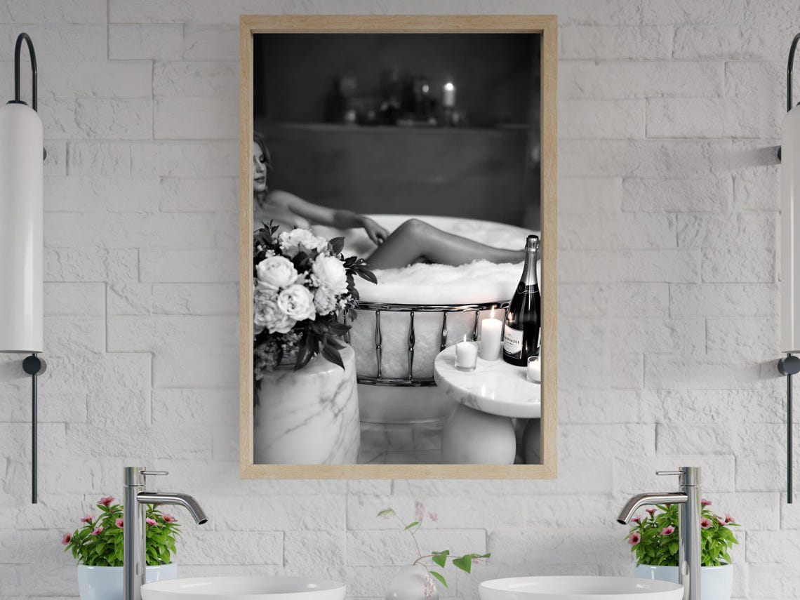 Woman Relaxing in Bubble Bath with Flowers and Champagne Poster