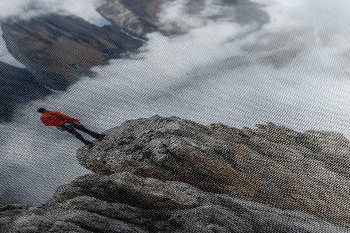 Red Jacket Hiker On Cliff Edge Over Cloud Valley High Peaks Poster - Image 2