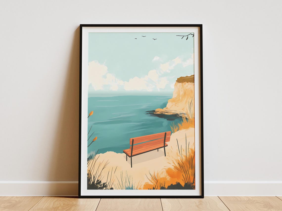Wooden Bench Overlooking a Calm Teal Sea From a Sandy Cliff Poster