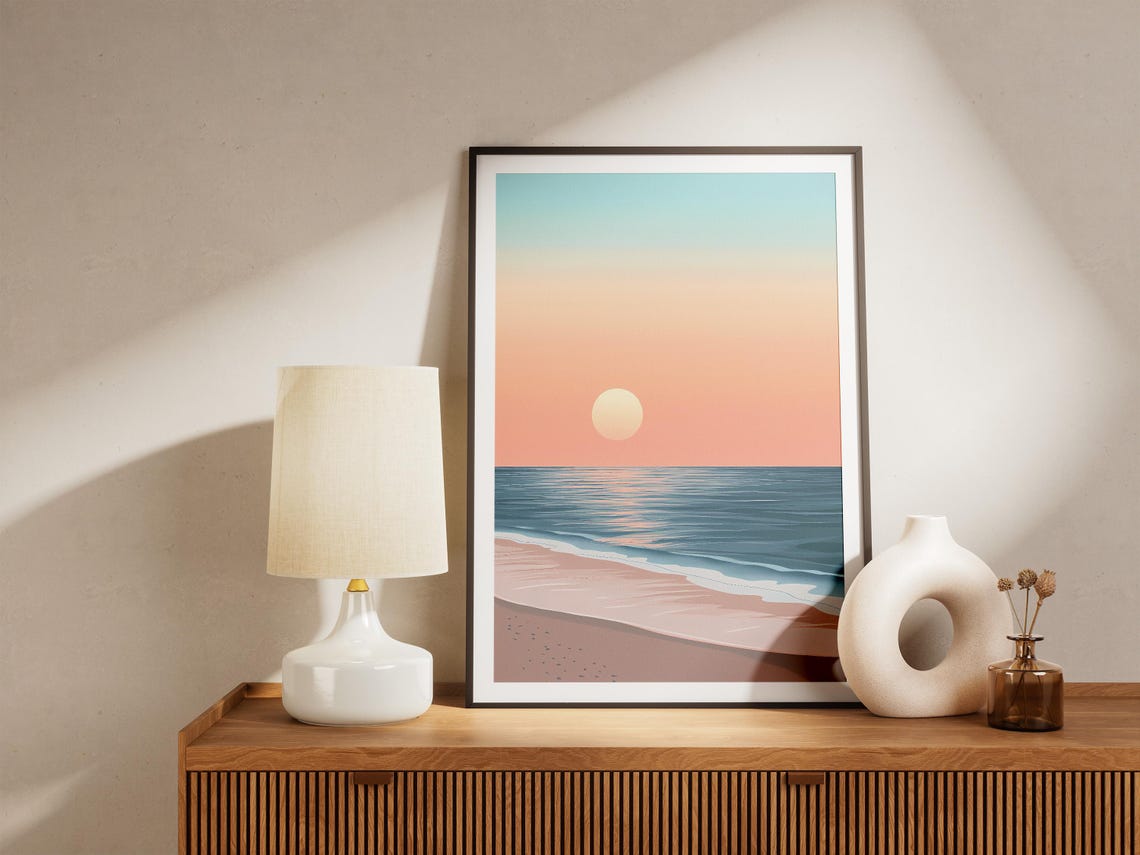 Pastel Peach Sunset Over a Calm Blue Ocean Beach Shoreline Poster - Image 5
