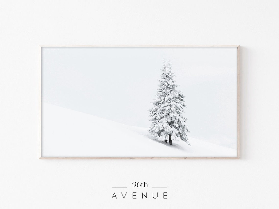 Lone Snow Covered Fir Tree on White Hillside Minimalist Poster