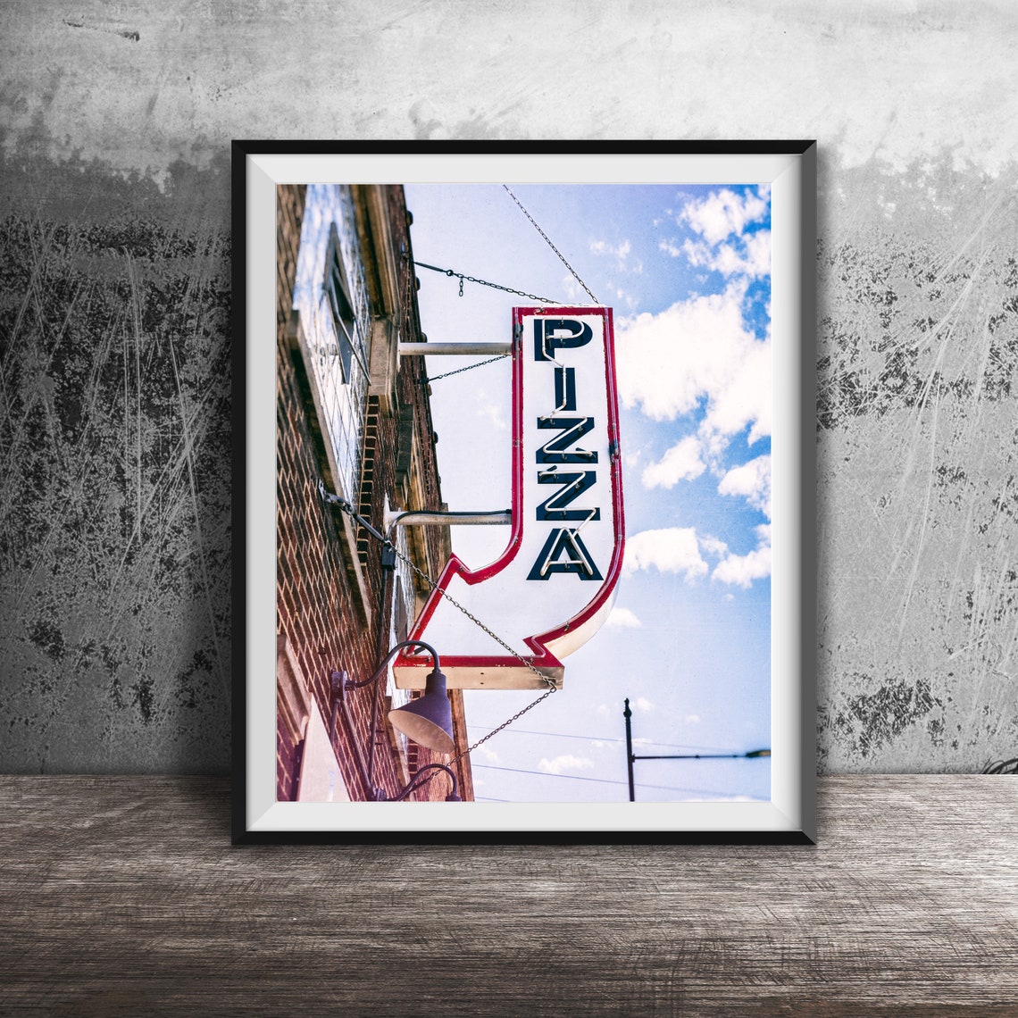 Vintage Arrow Shaped Pizza Neon Sign on Brick Building Poster