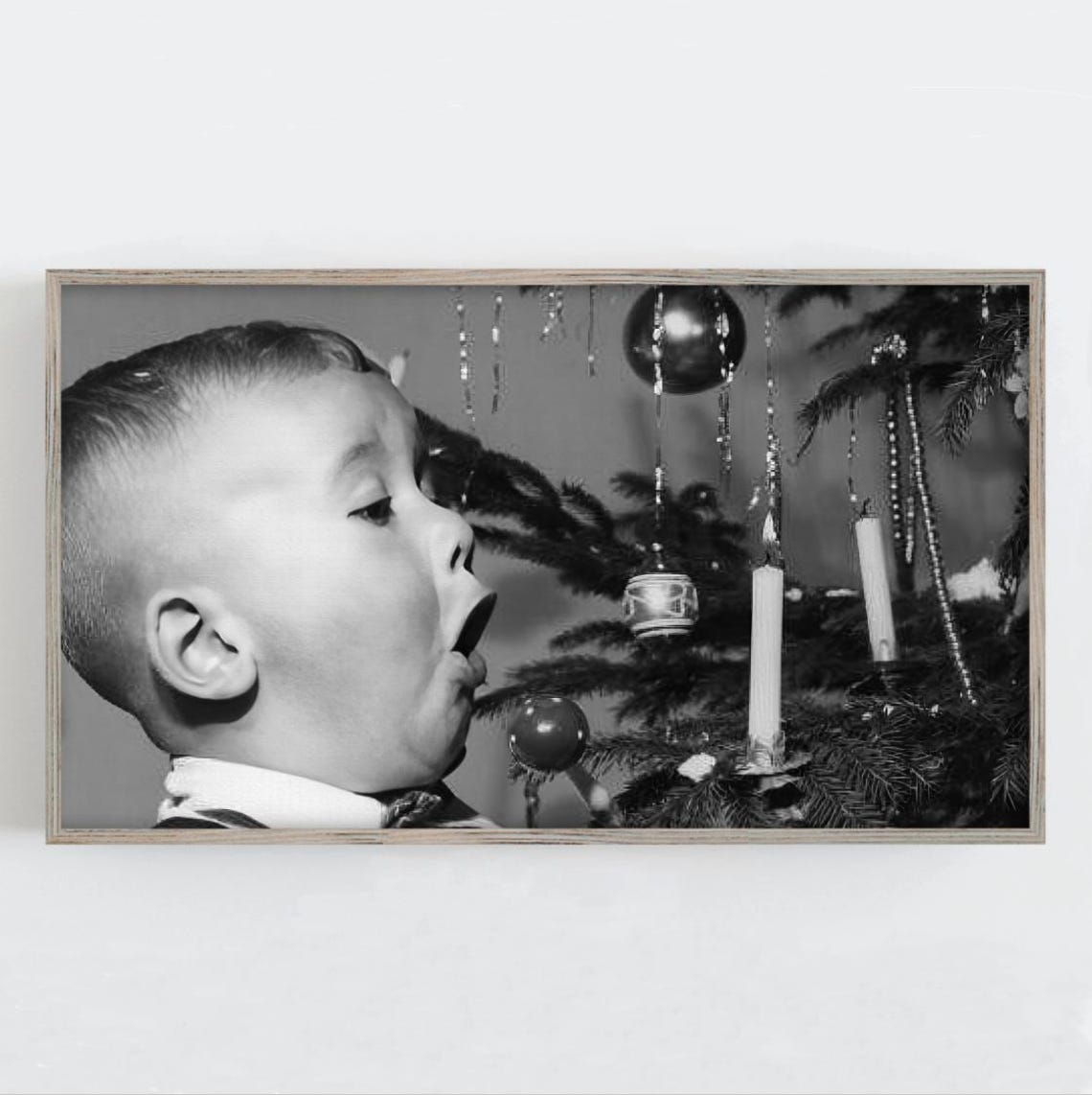 Boy Blowing Out Candle on Christmas Tree Vintage Black and White Print