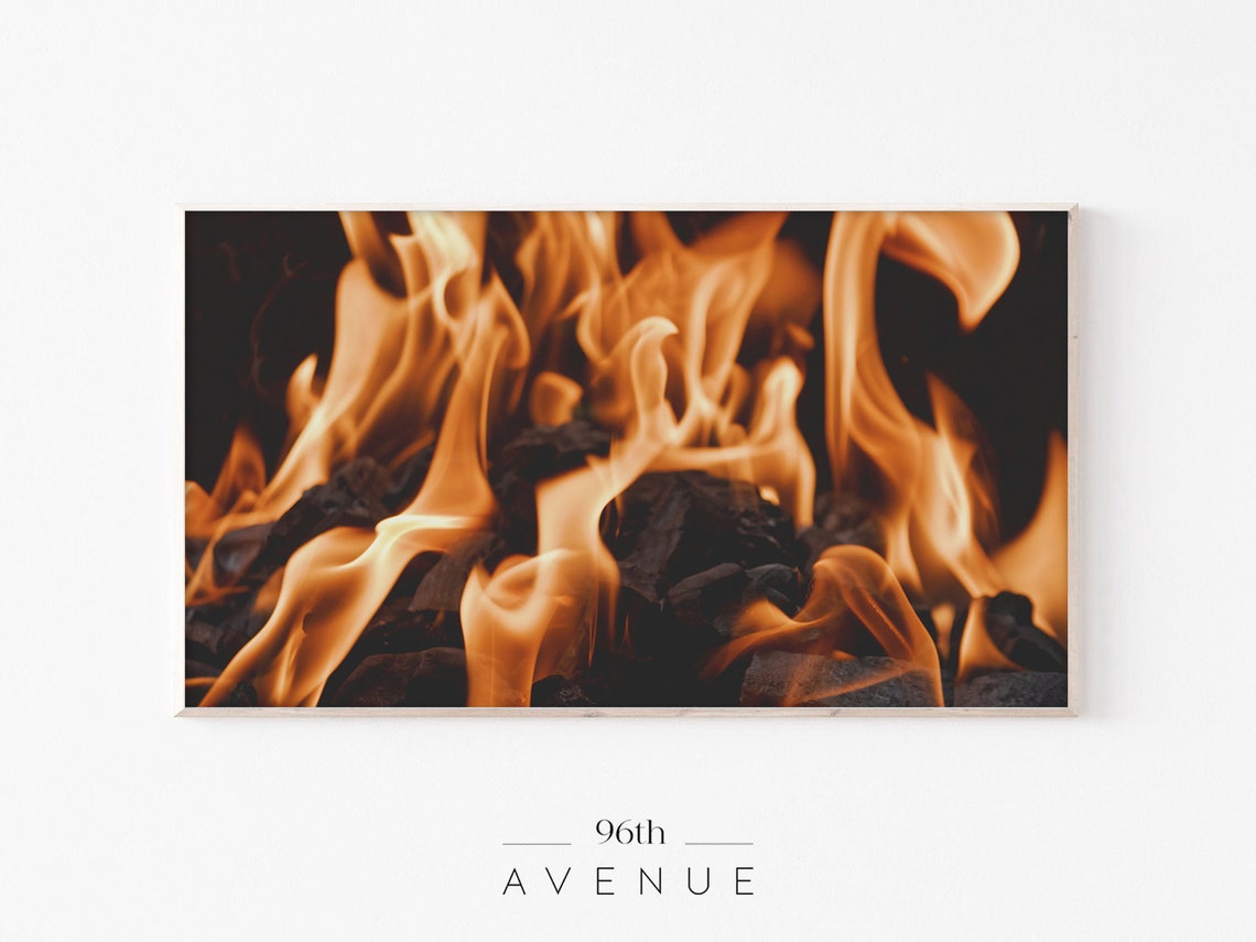 Close Up of Bright Orange Fireplace Flames on Dark Coals Poster