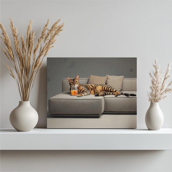 Bengal Cat Minimalist Canvas Wall Art Neutral Decor Print With Contemporary Sofa Scene Cozy Pillows Cocktail Glass Beige Gray