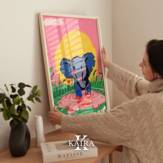 Happy Baby Elephant Splashing Playfully in a Pink Puddle Poster
