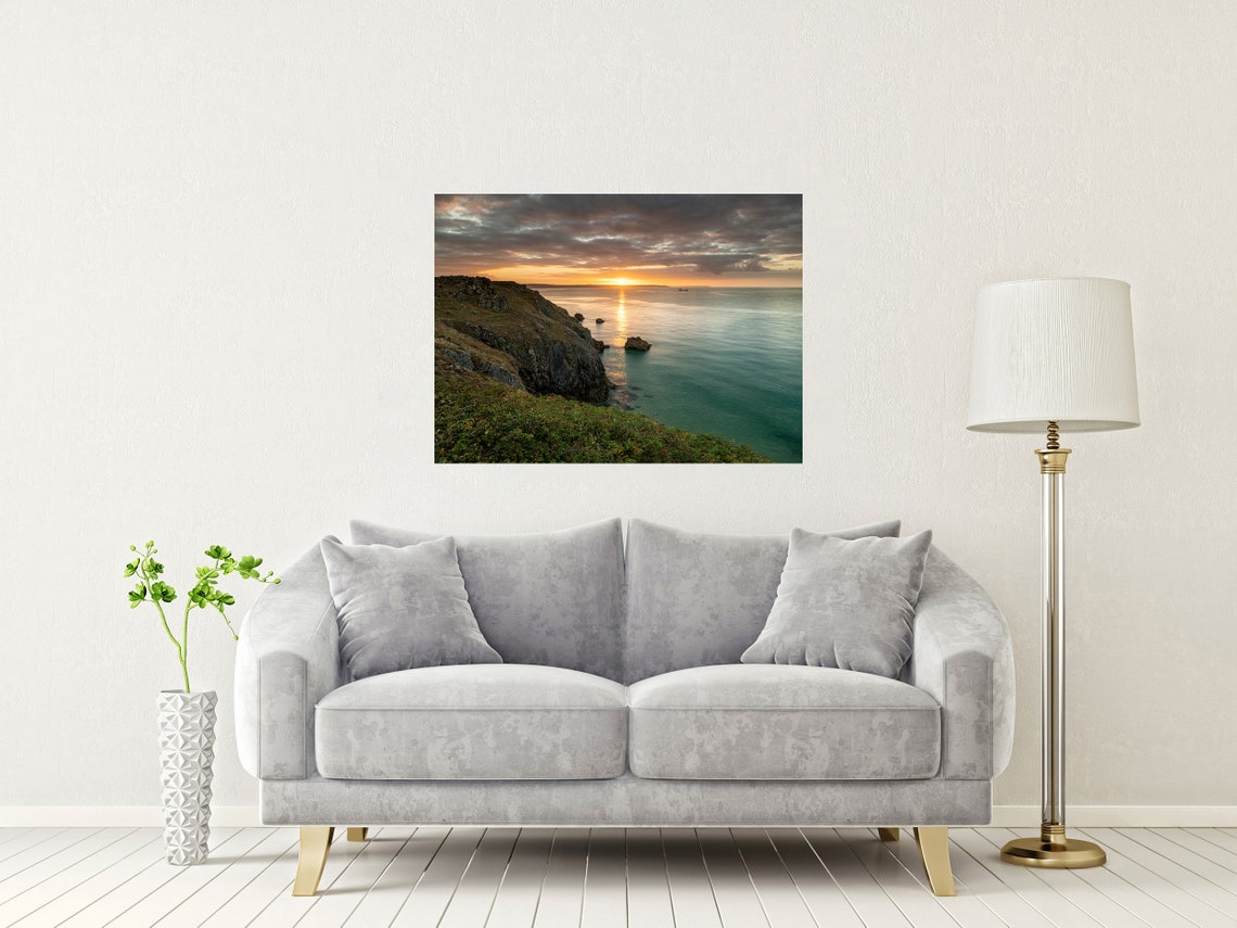Sunset Over Rocky Coastal Cliffs and Calm Turquoise Sea Poster - Image 2