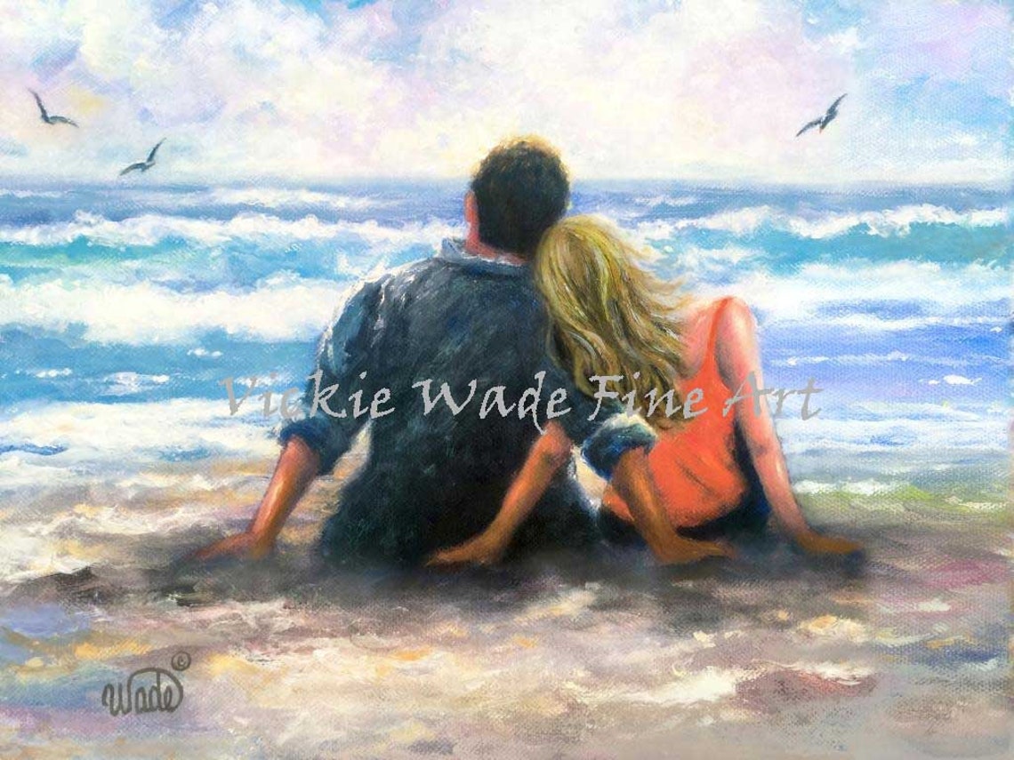 Romantic Beach Couple Sitting Together at the Shoreline Poster