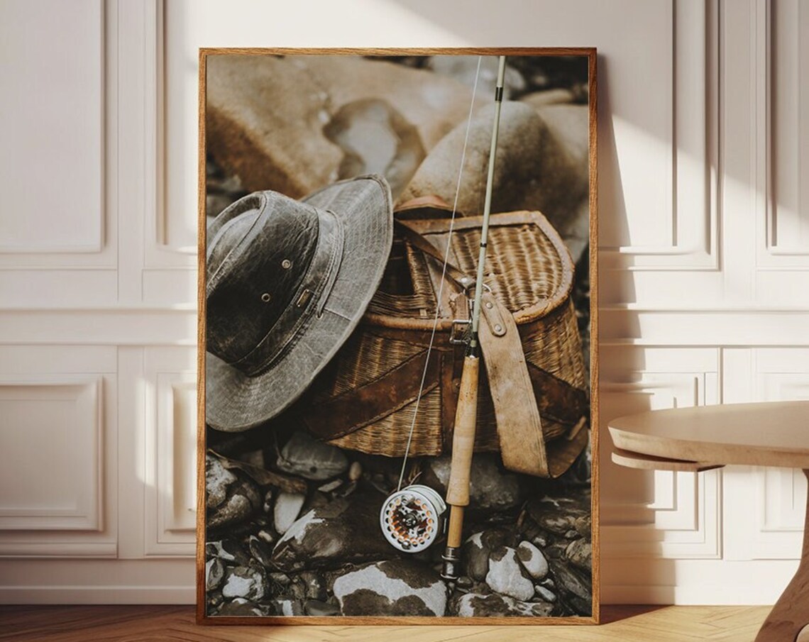 Vintage Fly Fishing Gear Creel Rod and Hat On River Rocks Poster