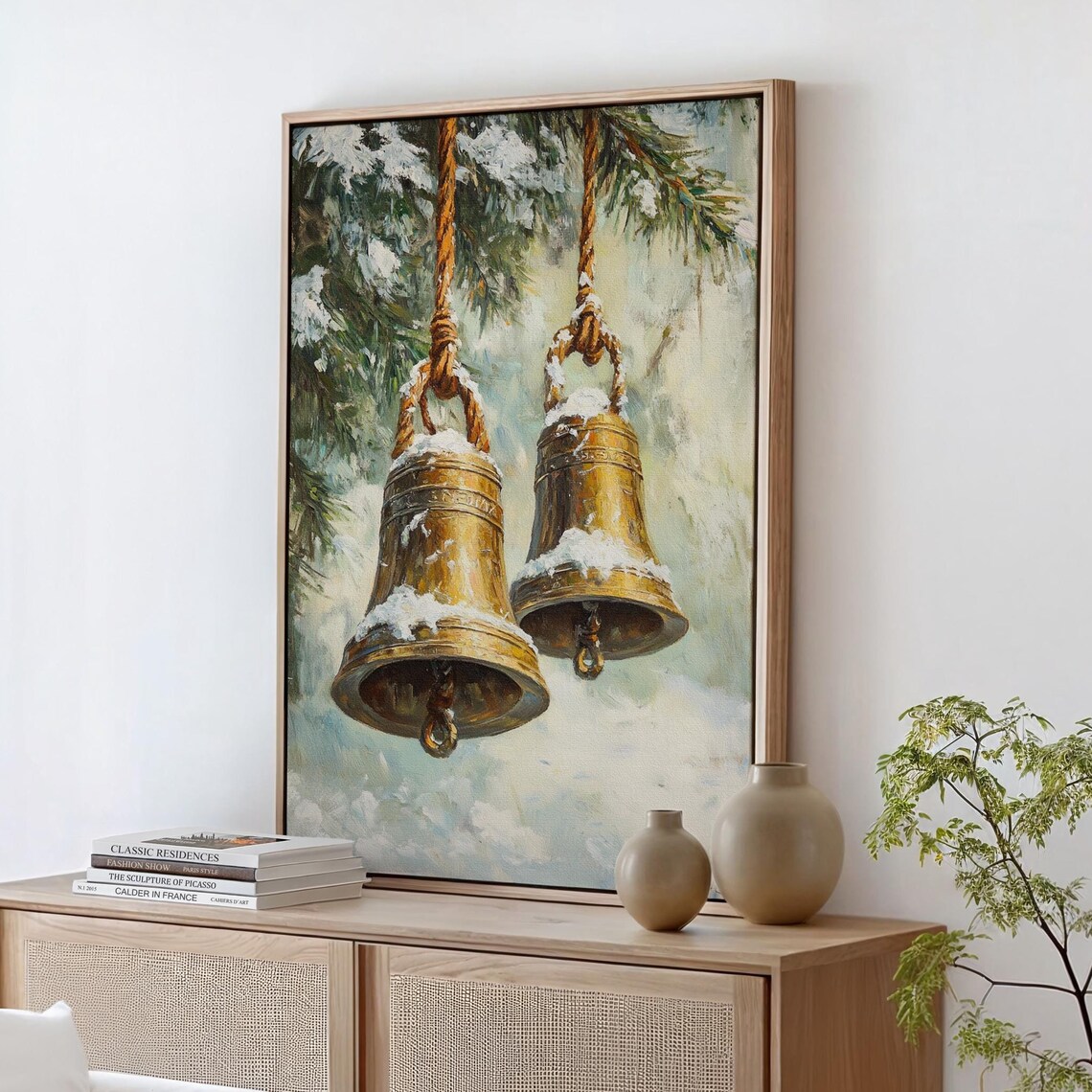 Golden Bells Hanging From Ropes Against Snowy Evergreens Art Print