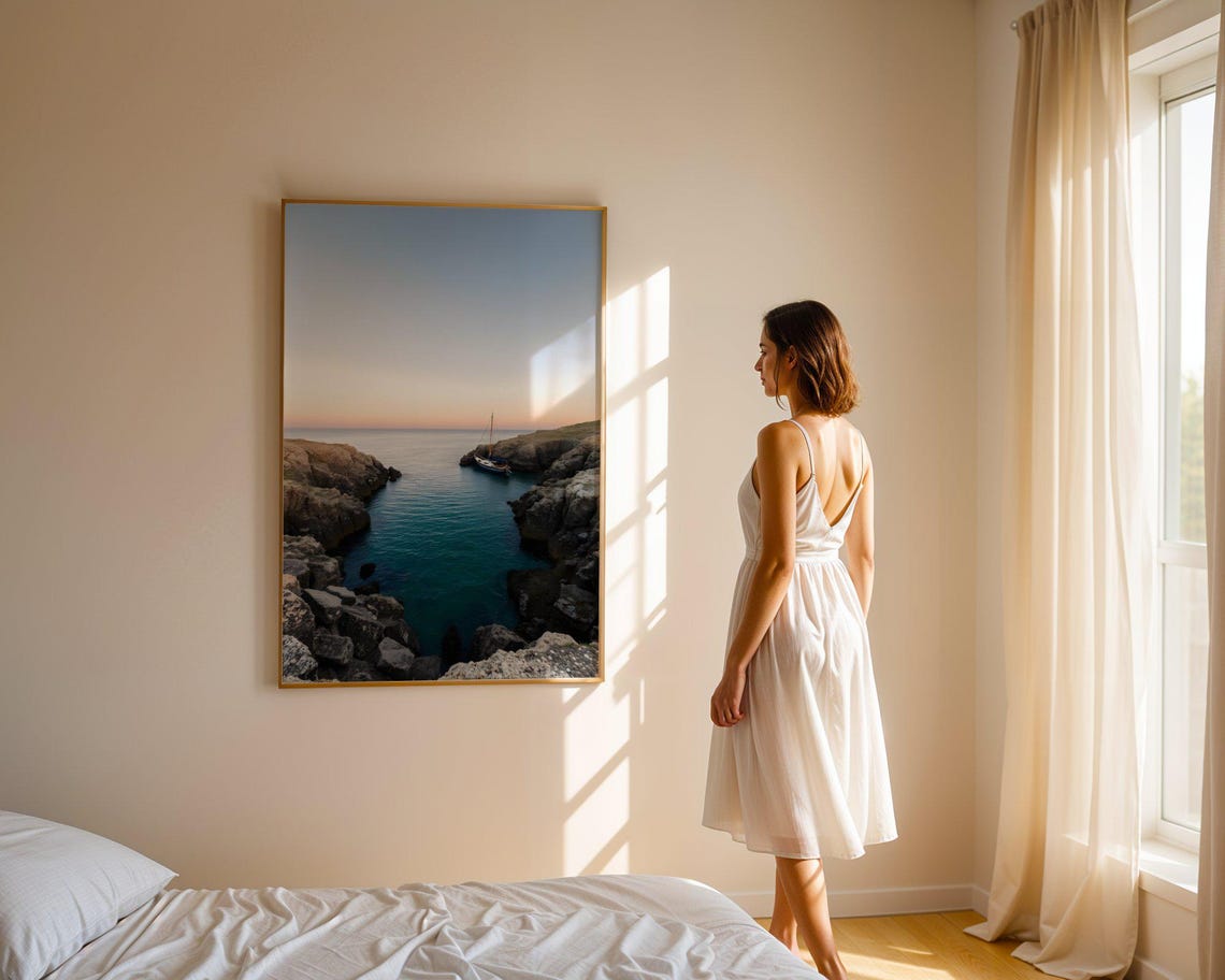 Lone Sailboat Anchored in a Rocky Coastal Cove at Dusk Poster - Image 4