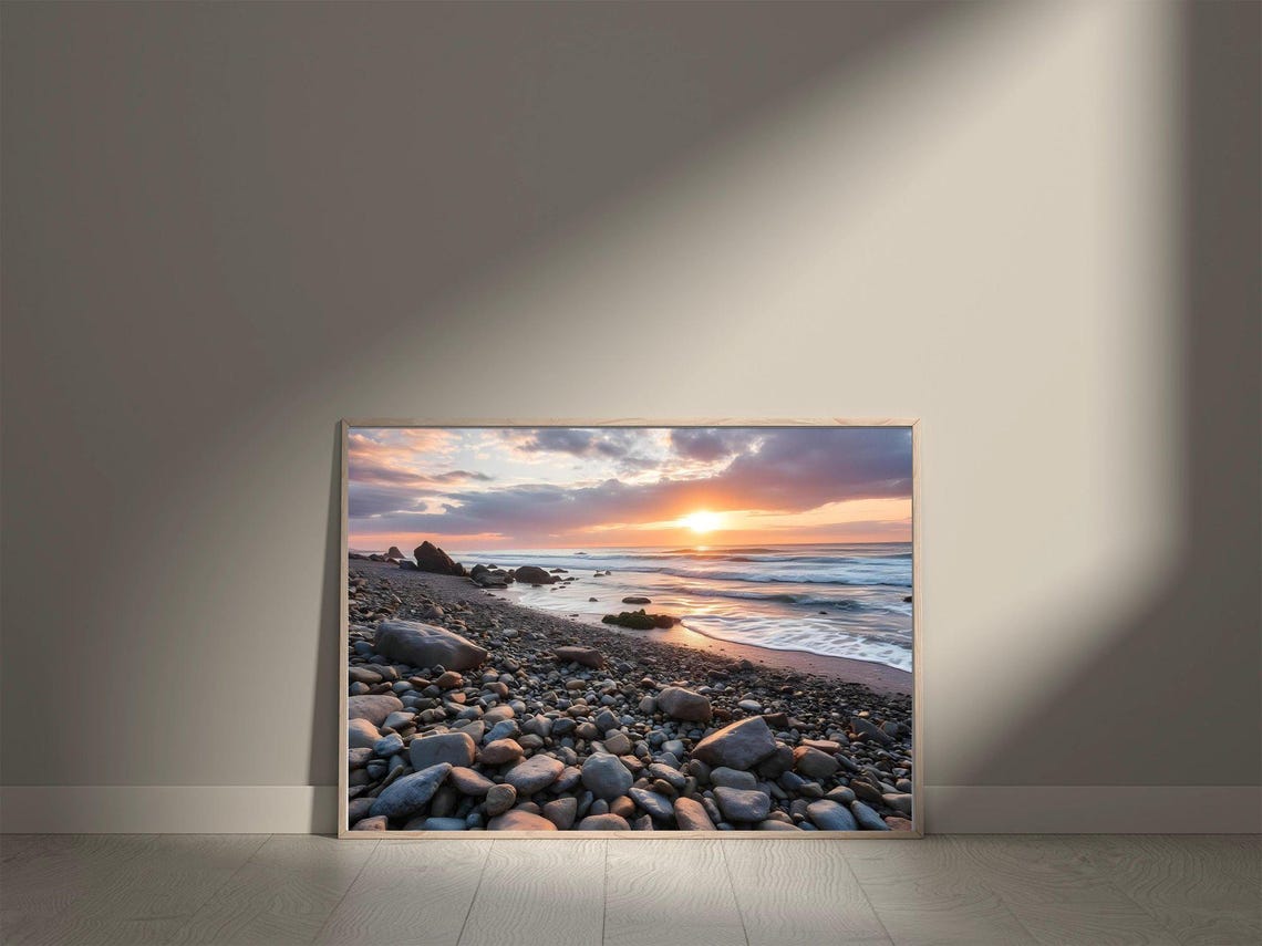 Sunset Over a Rocky Pebble Beach with Rolling Ocean Waves Poster - Image 5