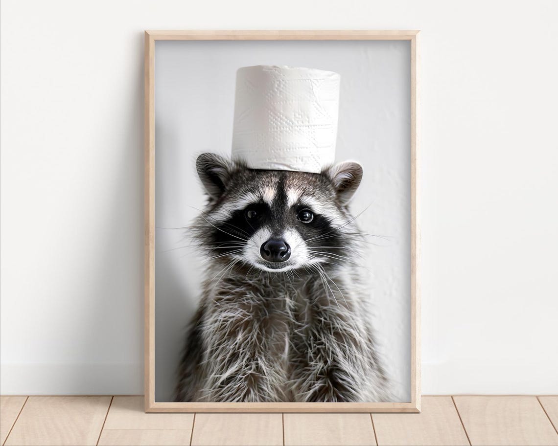 Adorable Raccoon Balancing Toilet Paper Roll on Its Head Poster