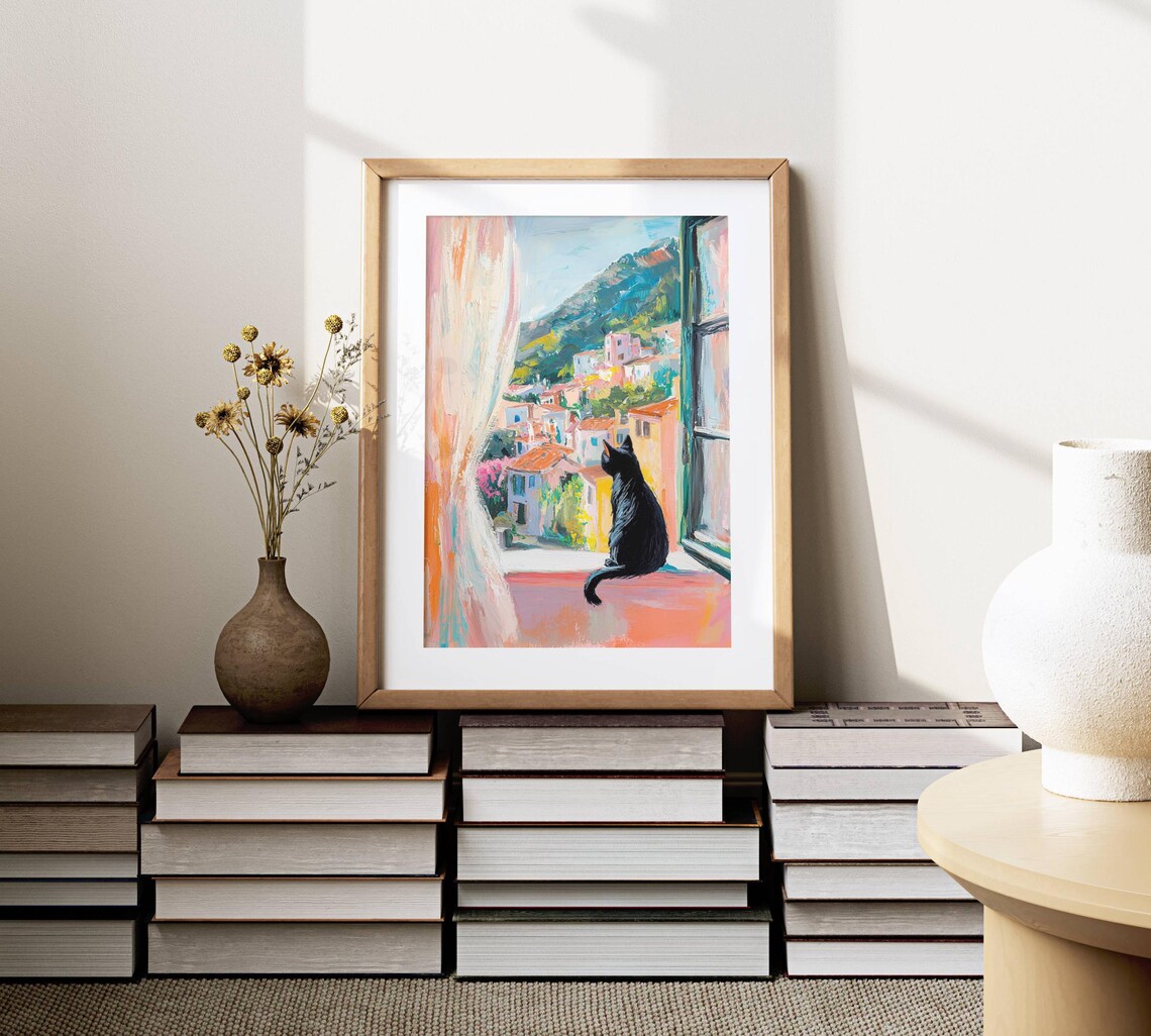 Black Cat on a Windowsill Above a Colorful Coastal Town View Poster - Image 2