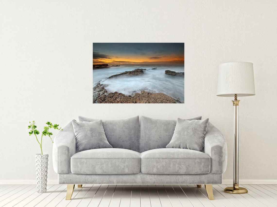 Long Exposure Waves Washing Over a Rocky Shore at Sunset Poster - Image 2