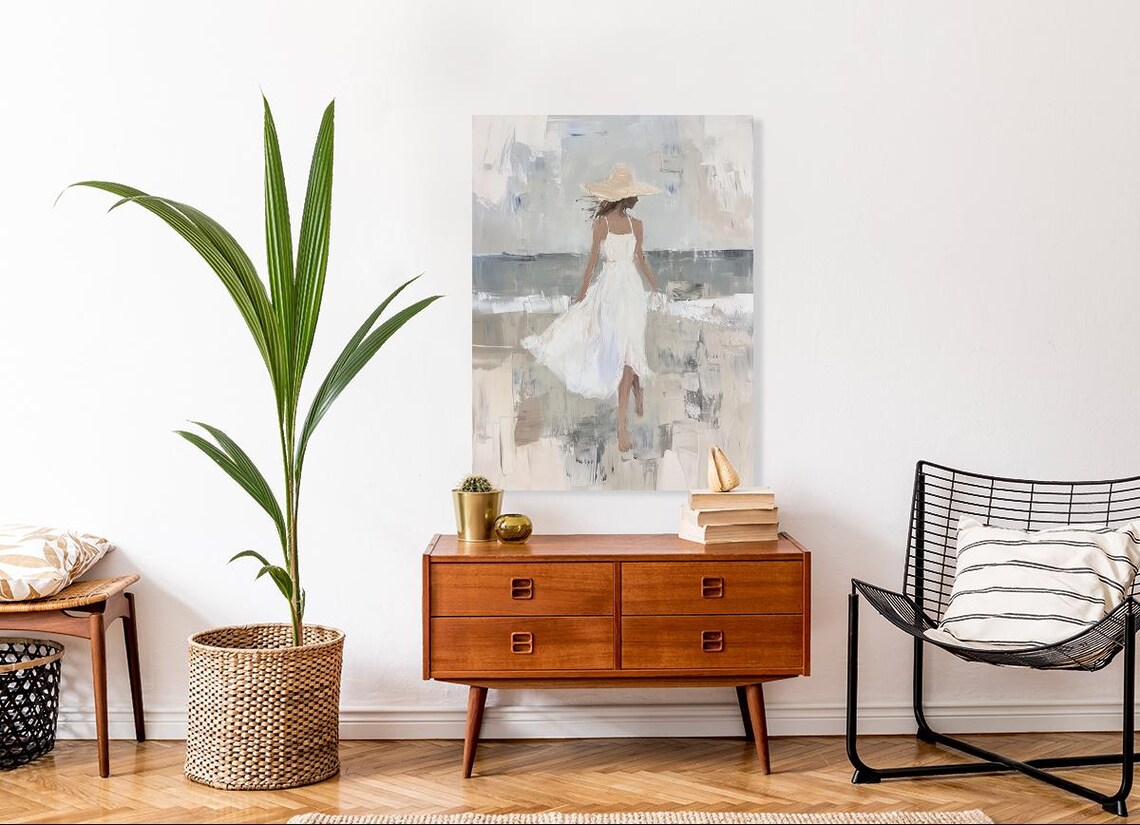 Woman in White Dress and Straw Hat on a Windy Beach Walk Poster - Image 2