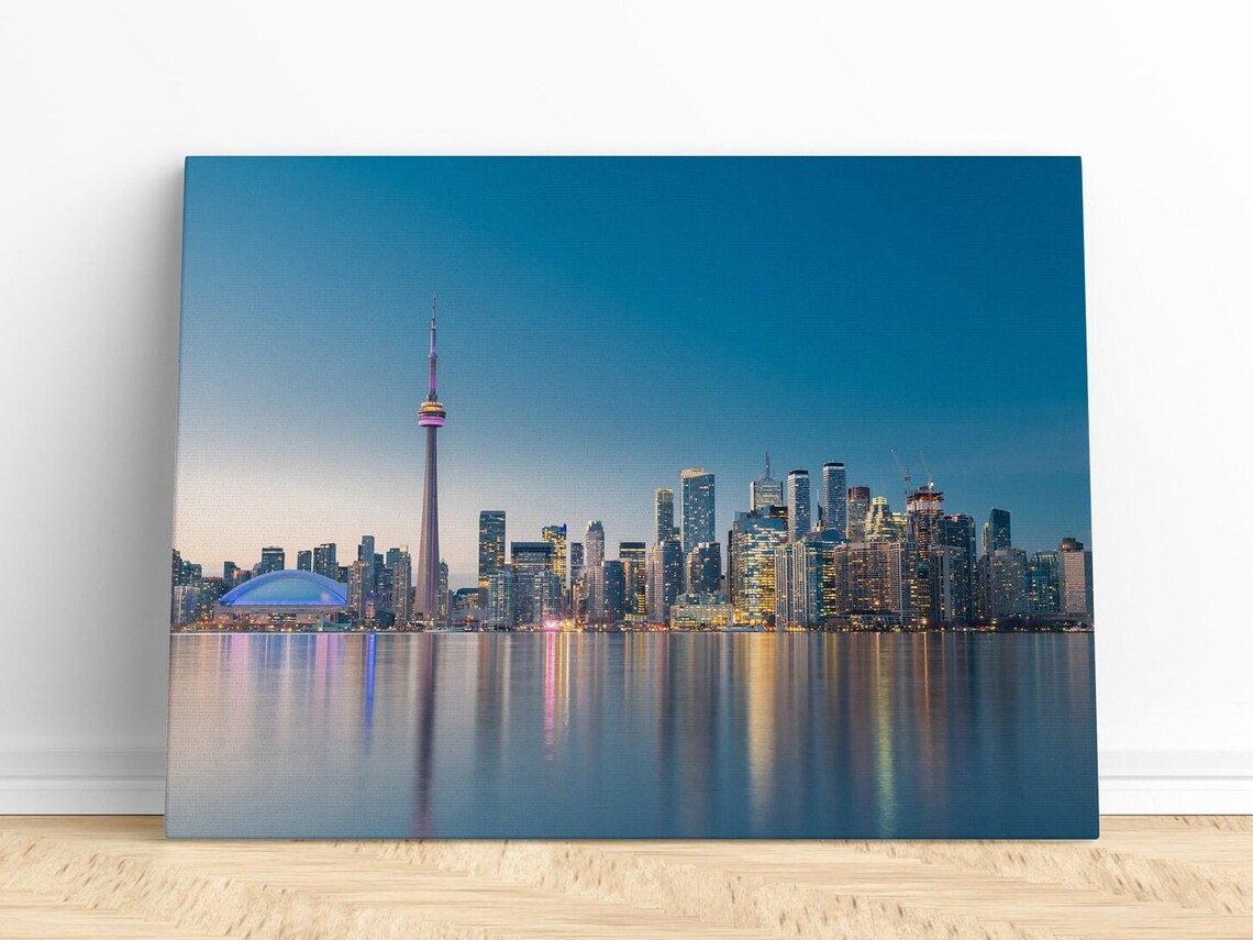 Toronto Skyline With CN Tower At Dusk Over Calm Water Poster