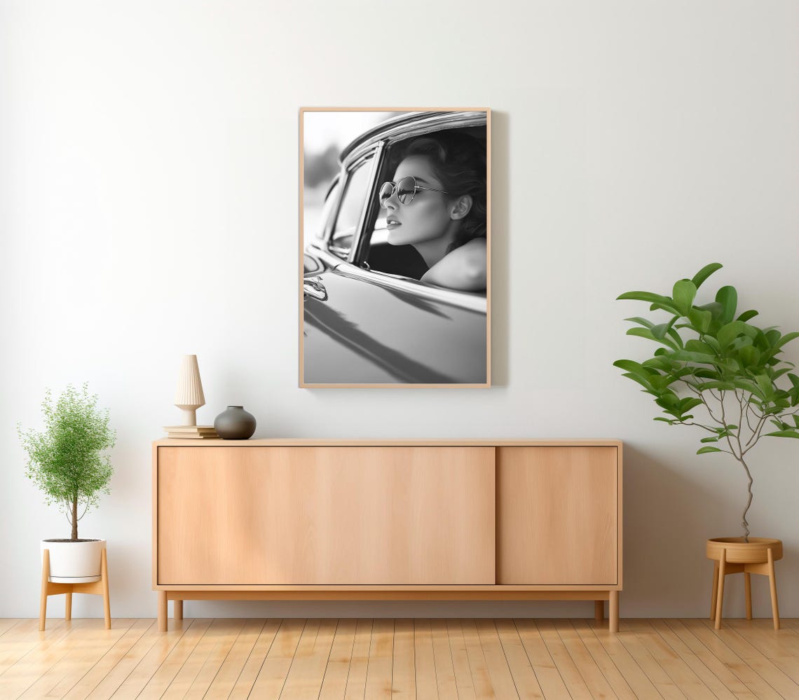 Vintage Woman in Sunglasses Leaning From a Classic Car Poster - Image 2