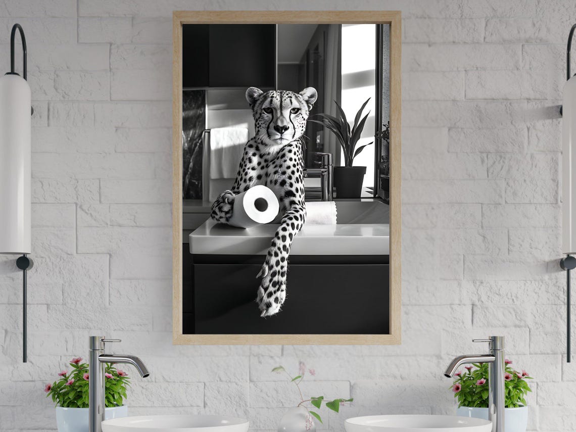 Cheetah Lounging on a Bathroom Counter With Toilet Paper Poster