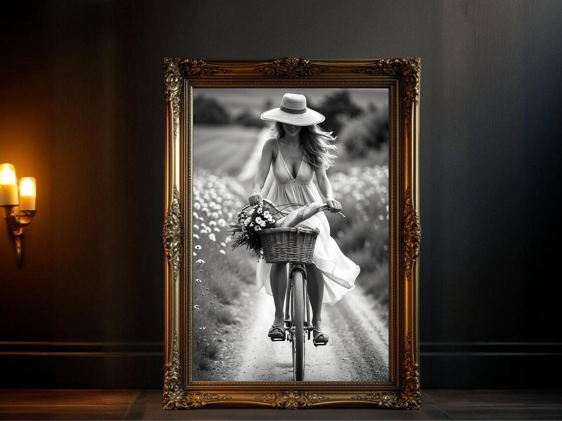 Woman in Sunhat Cycling Country Road with Flower Basket Poster