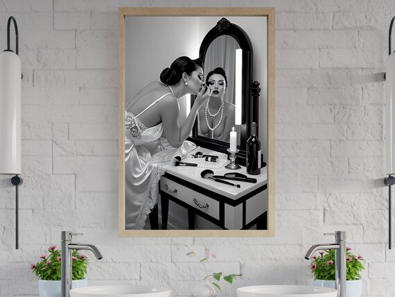 Woman Applying Makeup at a Vanity Mirror in Black and White Poster